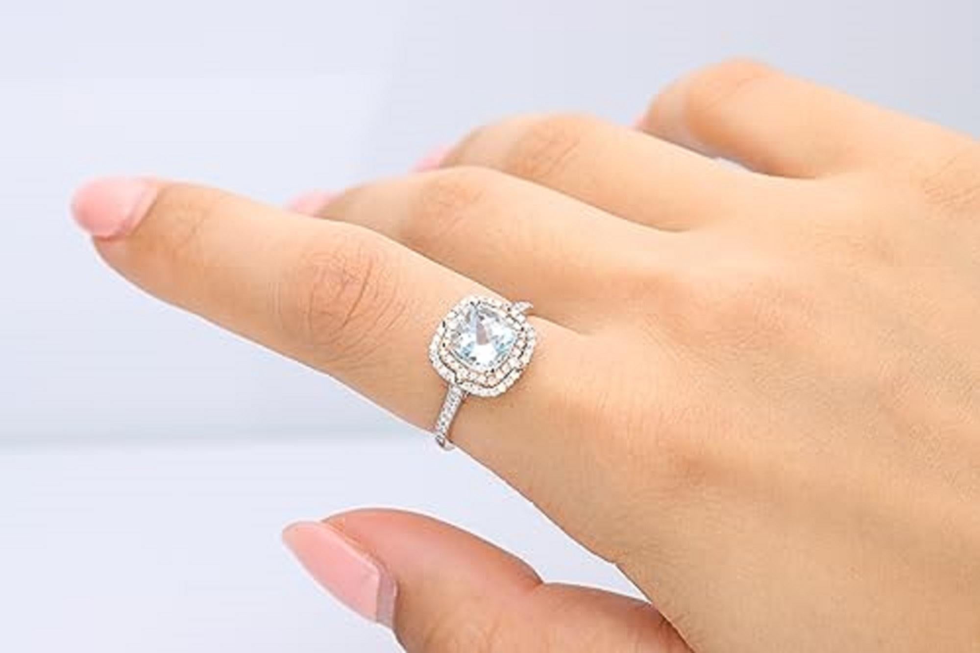 Decorate yourself in elegance with this Ring is crafted from 14-karat two tone Gold by Gin & Grace. This Ring is made up of 7.0 mm Cushion-cut Aquamarine (1 Pcs) 1.41 carat and Round-cut White Diamond (66 Pcs) 0.30 carat. This Ring is weight 2.78