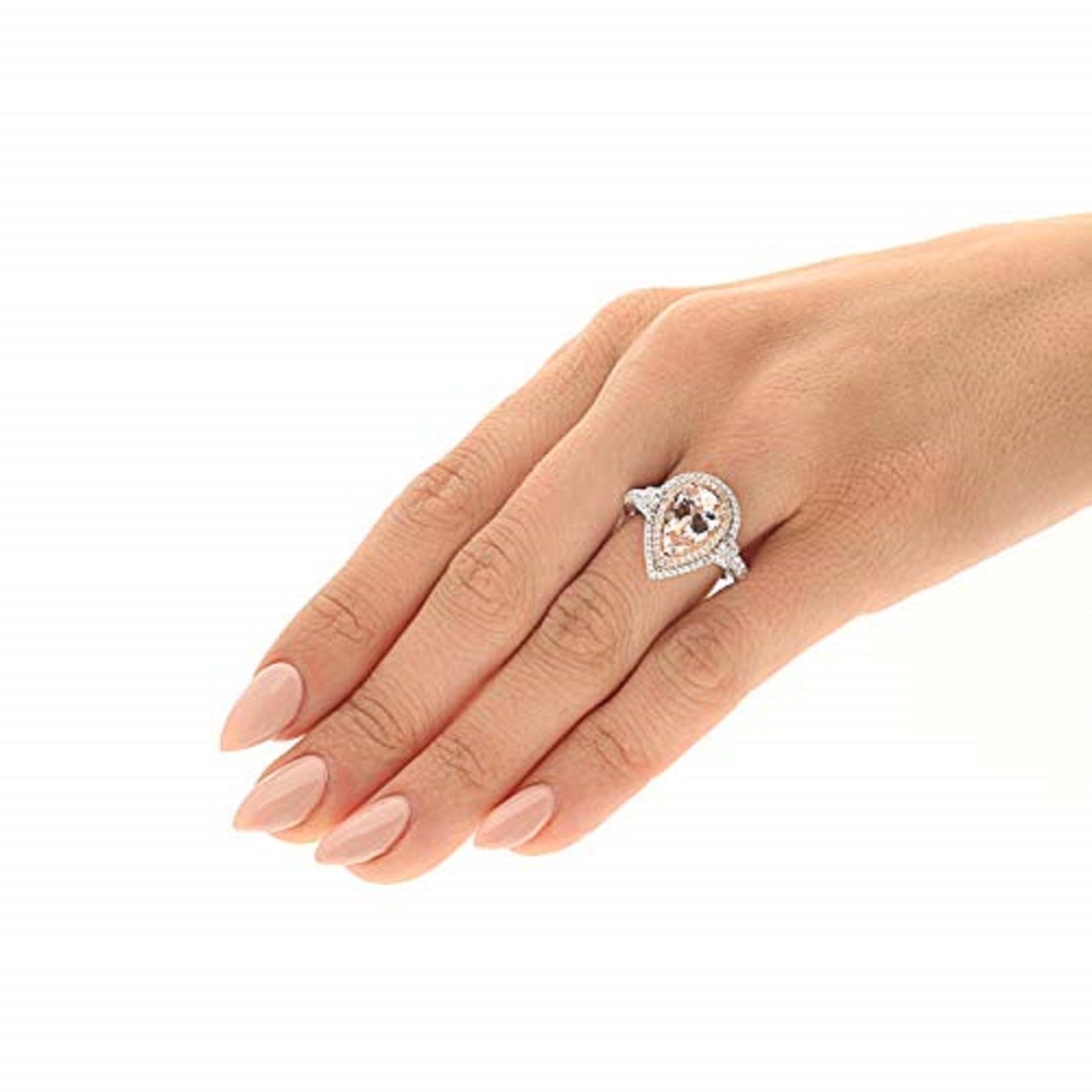 Dieser wunderschöne Ring ist aus 14-karätigem Two Tone Gold gefertigt und mit einem echten Gin and Grace Morganit im Birnenschliff und funkelnden Diamanten besetzt. Die Hochglanzpolitur verleiht diesem Stück einen strahlenden Glanz. Edelsteinfarben: