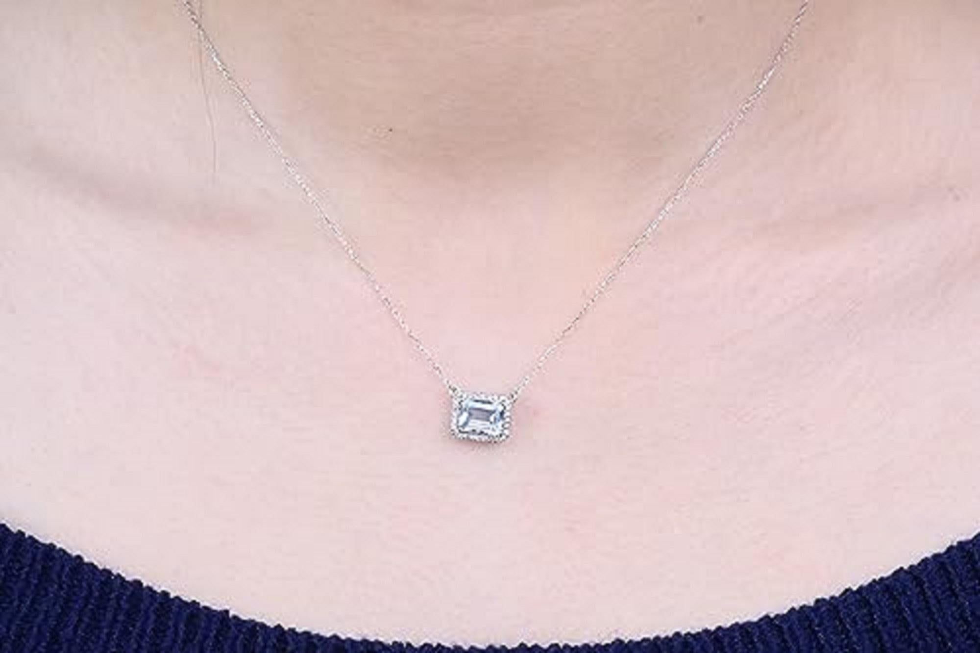 Decorate yourself in elegance with this Pendant is crafted from 14-karat white Gold by Gin & Grace. This Pendant is made up of 6*8 mm aquamarine Emerald-cut(1 pcs ) 1.35 carat and Round-cut Diamond (28 Pcs) 0.14 carat. This Pendant is weight 1.79