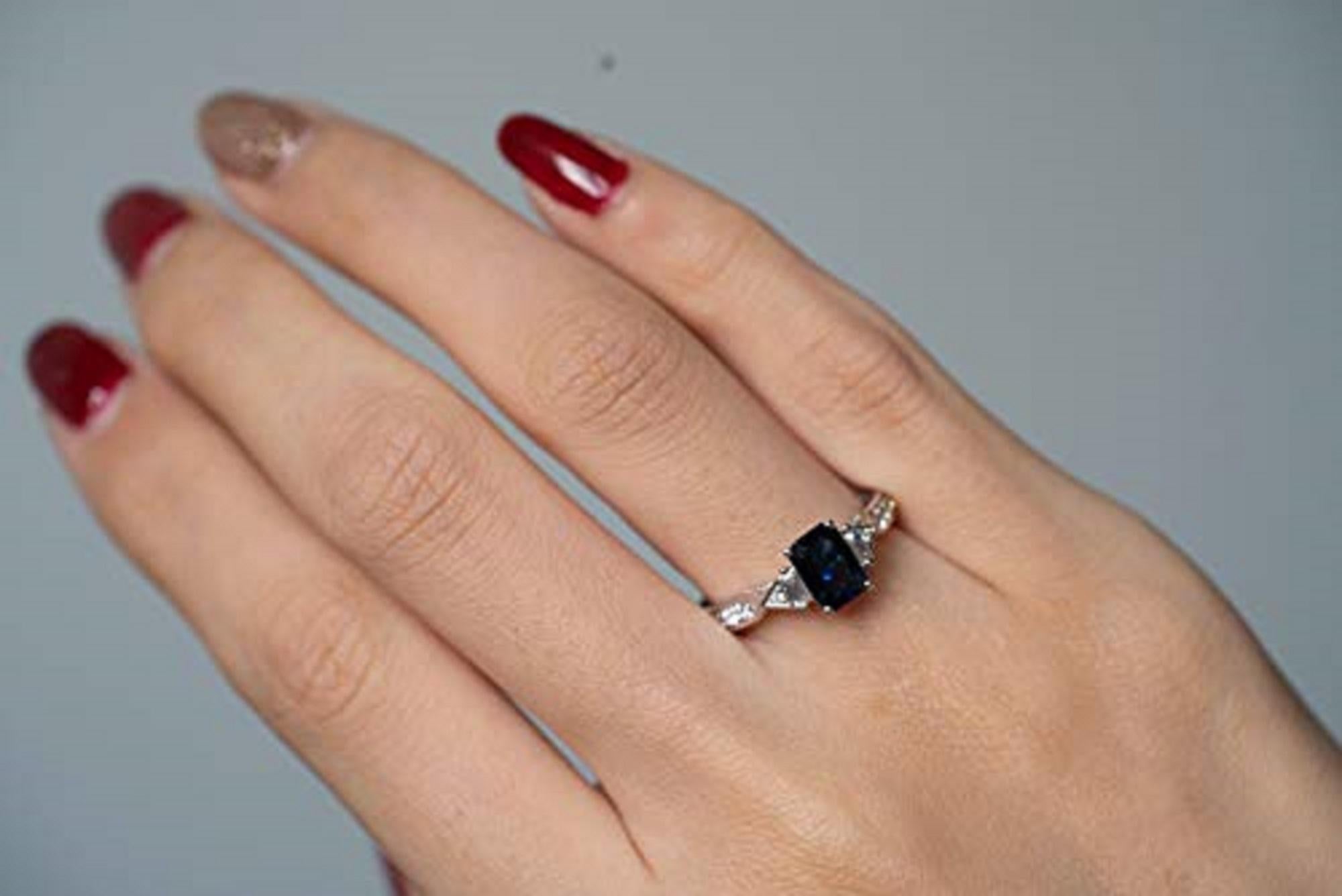 Stunning, timeless and classy eternity Engagement ring. Decorate yourself in luxury with this Gin & Grace ring. This ring is made up of 5X7 Emerald-Cut Prong Setting Genuine Blue Sapphire (1 pcs) 1.17 Carat and Round-Cut Prong Setting Diamond (12