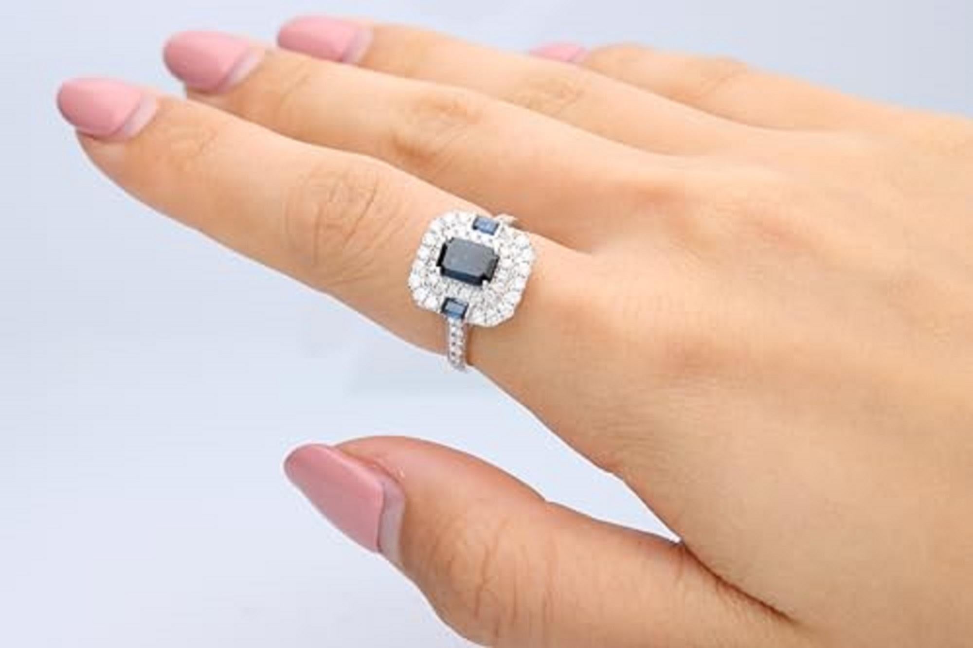 Decorate yourself in elegance with this Ring is crafted from 14-karat White Gold by Gin & Grace. This Ring is made up of 7x5 Emerald-Cut (1 pcs) 1.07 carat Blue Sapphire and 3.5x2 Baguette-cut (2 Pcs) 0.21 Carat Blue Sapphire and Round-cut White