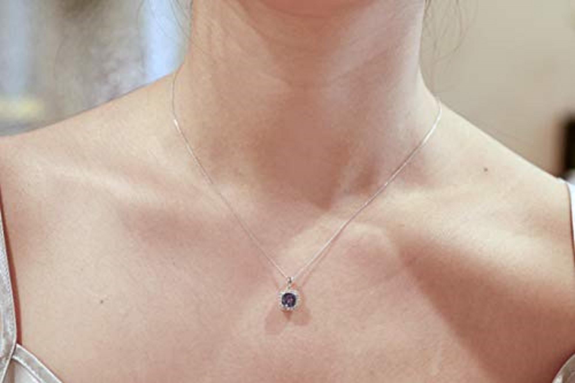Decorate yourself in elegance with this Pendant is crafted from 14-karat White Gold by Gin & Grace Pendant. This Pendant is made up of 6MM Cushion-Cut Prong setting Genuine Tanzanite (1 Pcs) 1.15 Carat and Round-Cut Prong setting Natural White
