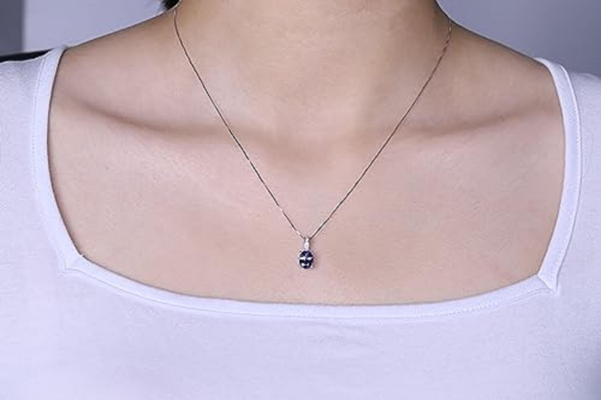 Decorate yourself in elegance with this Pendant is crafted from 14-karat White Gold by Gin & Grace Pendant. This Pendant is made up of 6*8 Oval-cut Prong setting Tanzanite (1 Pcs) 1.41 Carat and Round-Cut Prong setting White Diamond (4 Pcs) 0.03