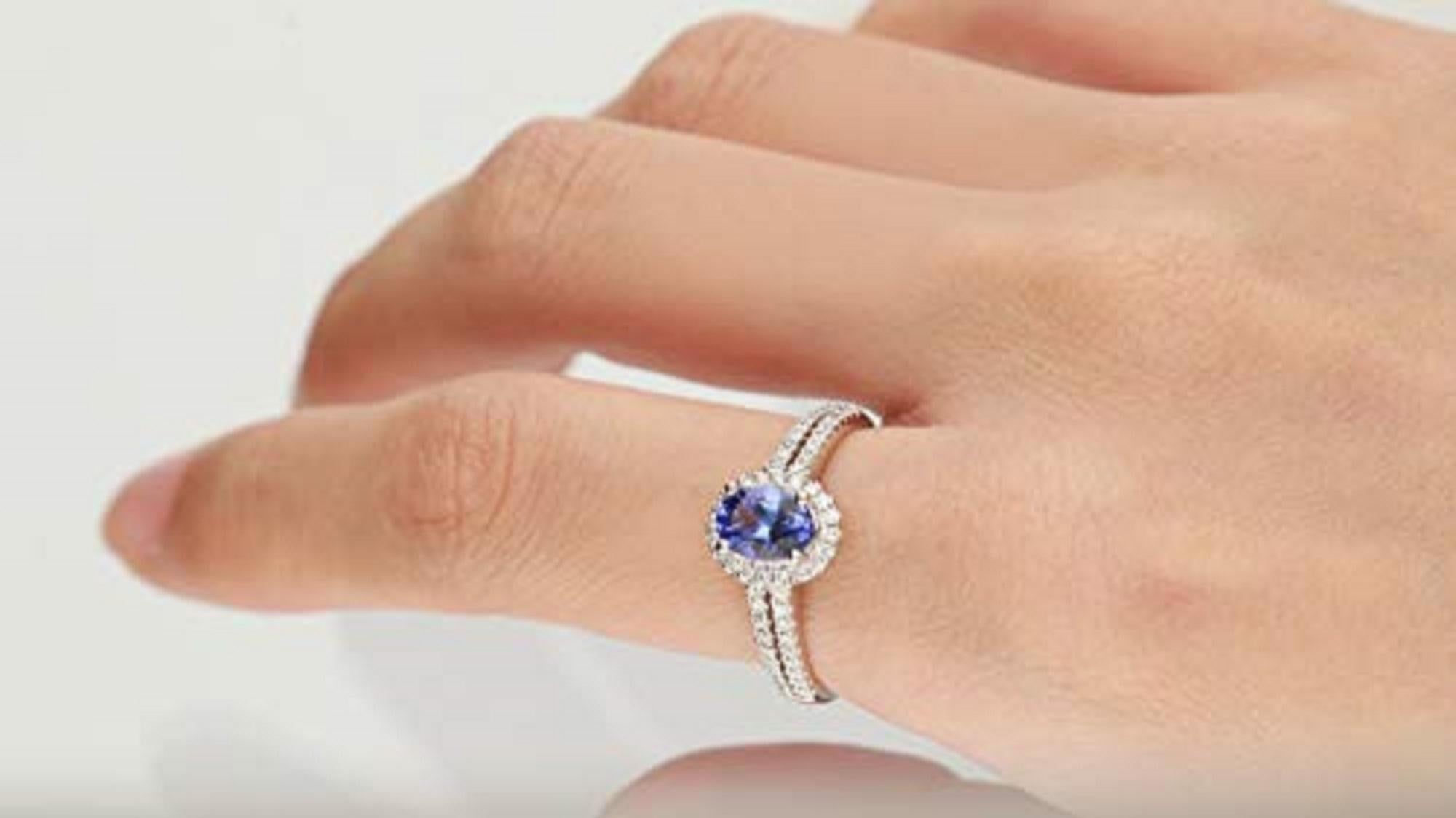 Stunning, timeless and classy eternity Unique Ring. Decorate yourself in luxury with this Gin & Grace Ring. The 14K White Gold jewelry boasts Oval-Shape Prong Setting Genuine Tanzanite (1 pc) 0.74 Carat along with Natural Round cut white Diamond (56