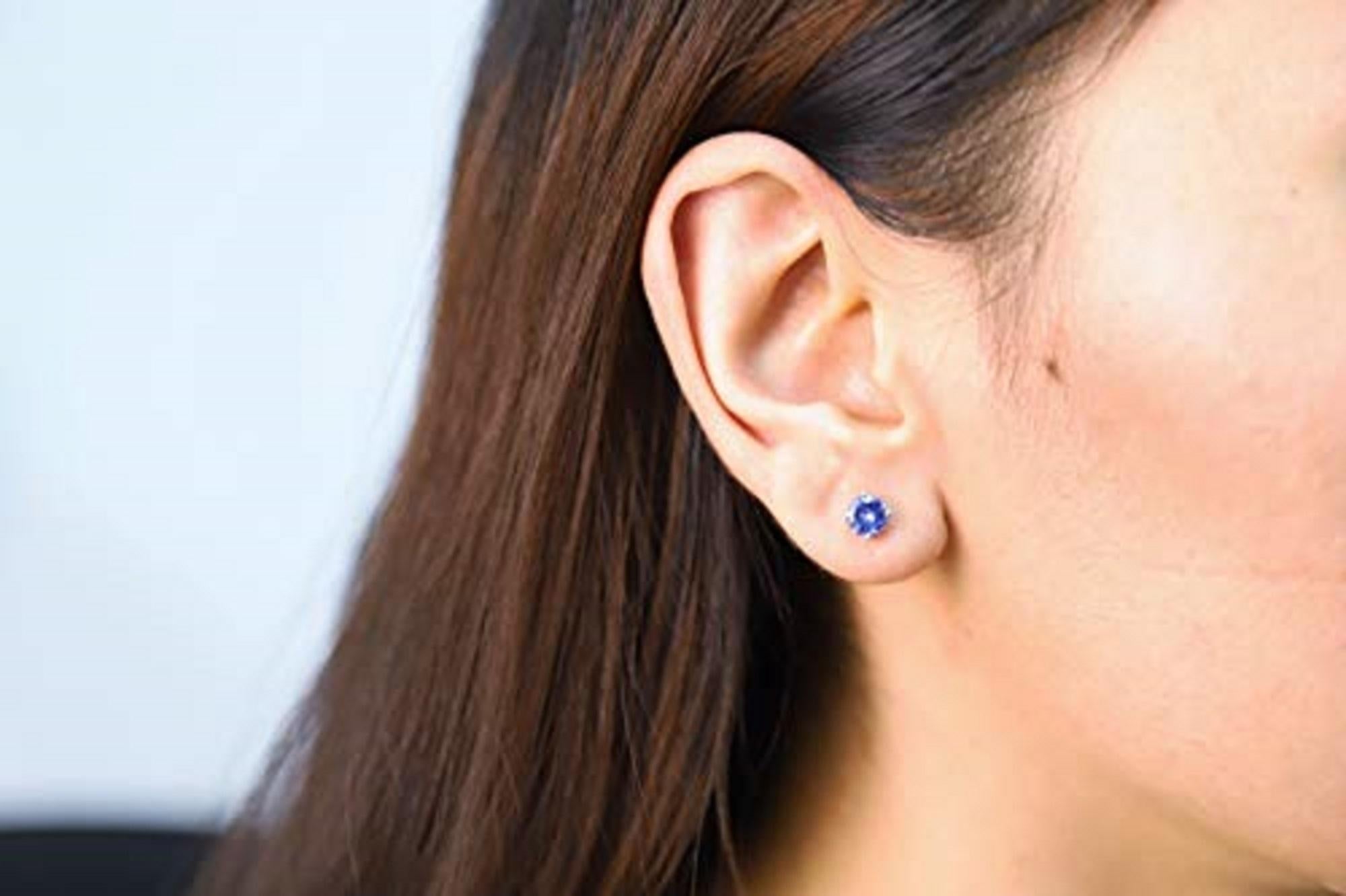 Decorate yourself in elegance with this Earring is crafted from 14K White Gold by Gin & Grace Earring. The jewelry boasts 6MM Round-Cut prong setting Blue color Tanzanite (2 pcs) 1.60 Carat. This Earring is weight 1.01 grams. This delicate Earring