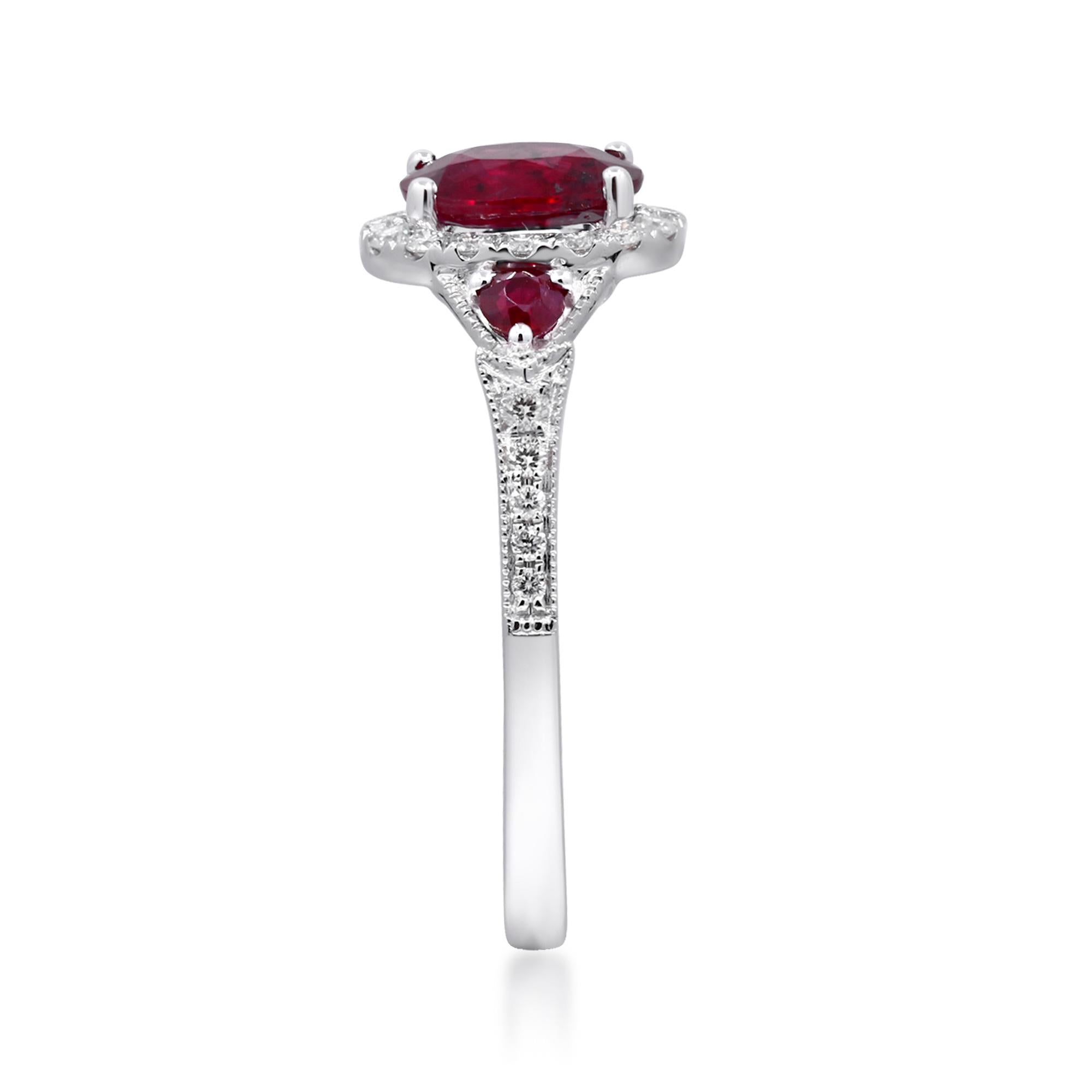 Decorate yourself in elegance with this Ring is crafted from 14-karat White Gold by Gin & Grace. This Ring is made up of 7x5 mm Oval-Cut Ruby (1 pcs) 1.00 carat, Round-cut Hot Pink Ruby (2 pcs) 0.15 carat and Round-cut White Diamond (26 Pcs) 0.23