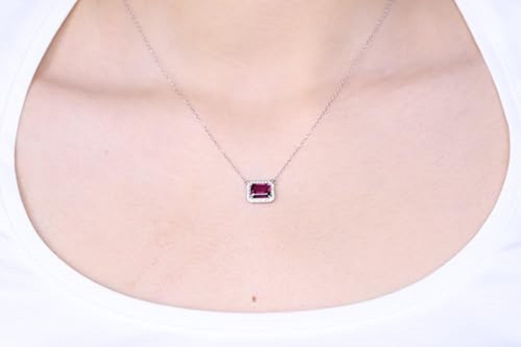 Decorate yourself in elegance with this Pendant is crafted from 14-karat White Gold by Gin & Grace. This Pendant is made up of 8x6 mm Emerald-Cut (1 pcs) 2.0 carat Rodolite and Round-cut White Diamond (28 Pcs) 0.14 Carat. This Pendant is weight 1.71