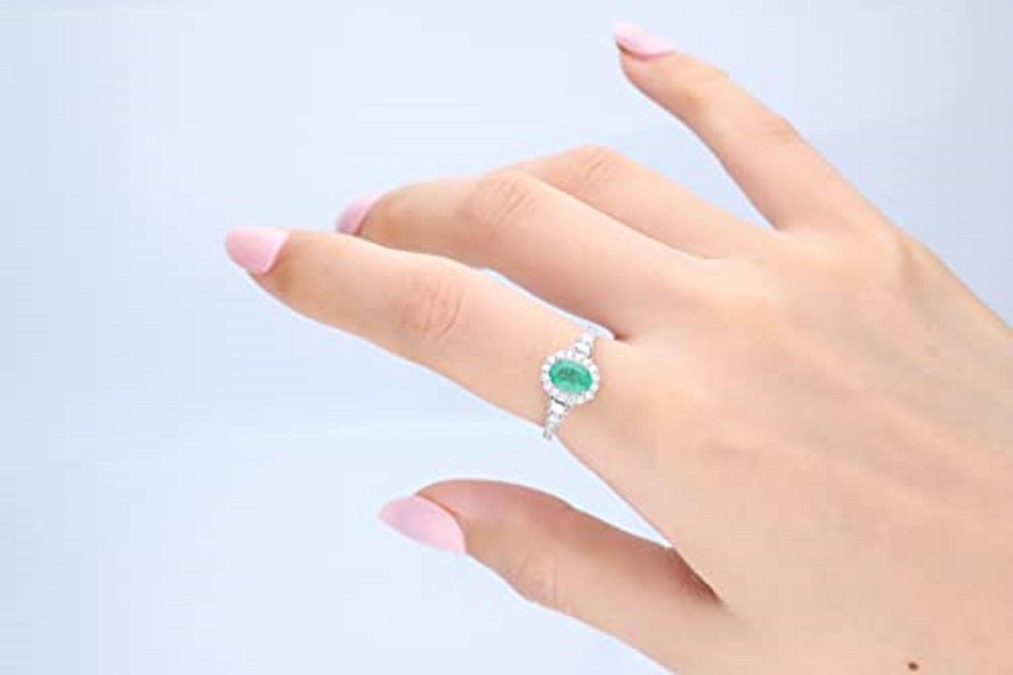 Decorate yourself in elegance with this Ring is crafted from 14-karat White Gold by Gin & Grace. This Ring is made up of 7x5 mm Oval-Cut Emerald (1 pcs) 0.68 carat and Round-cut White Diamond (28 Pcs) 0.13 Carat, Baguette-cut White Diamond (2 pcs)