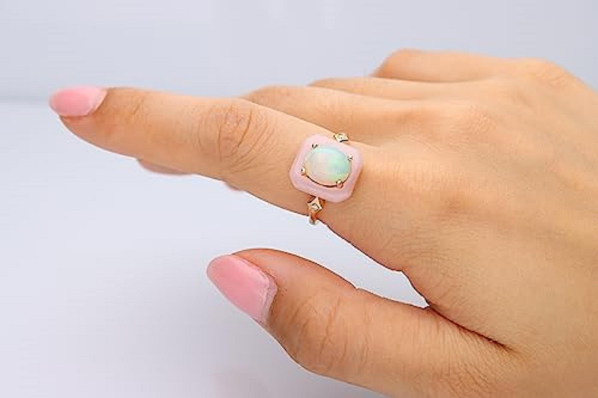 Decorate yourself in elegance with this Ring which is crafted from 14-karat Yellow Gold by Gin & Grace. This Ring is made up of 8*10 Oval-Cut Ethiopian opal (1 pcs) 1.63 carat, pink Opal free mix cut (1 pcs) 2 carat and Round-cut white diamond (2