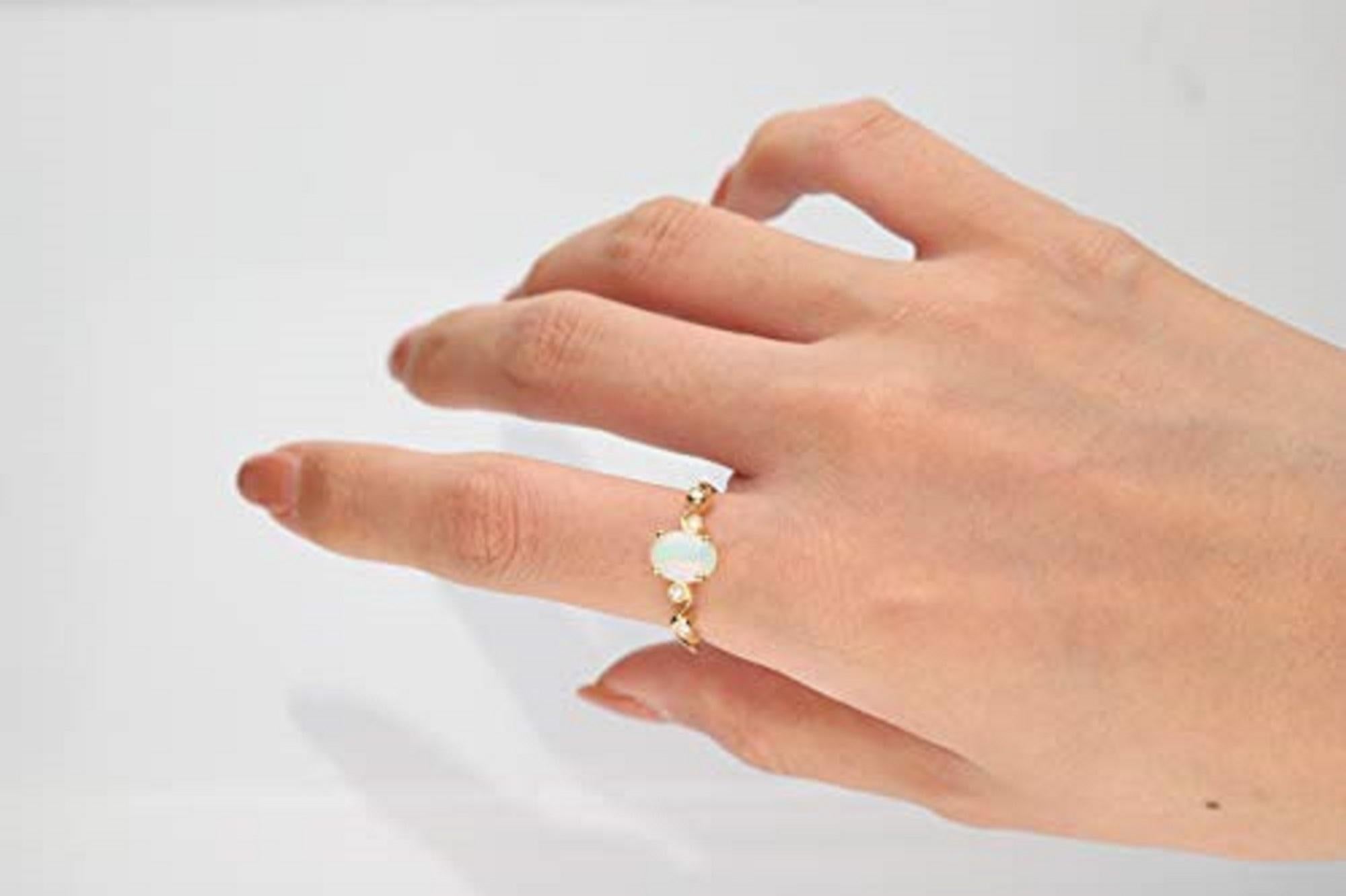 Stunning, timeless and classy eternity Unique ring. Decorate yourself in luxury with this Gin & Grace ring. This ring is made up of 8x6 MM Oval-cut Prong Setting Ethiopian Opal (1pcs) 0.90 Carat and Round-Cut Prong Setting Diamond (4pcs) 0.05 Carat