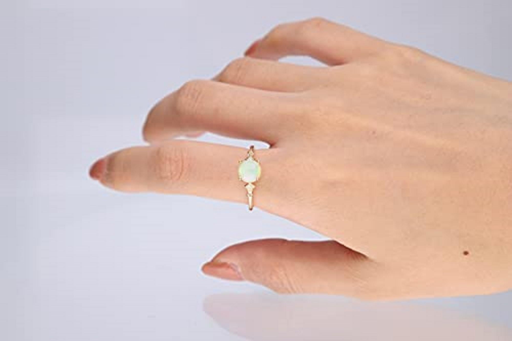 Stunning, timeless and classy eternity Unique ring. Decorate yourself in luxury with this Gin & Grace ring. This ring is made up of 7MM Round-cut Prong Setting Ethiopian Opal (1pcs) 1.11 Carat and Round-Cut Prong Setting Diamond (2pcs) 0.04 Carat