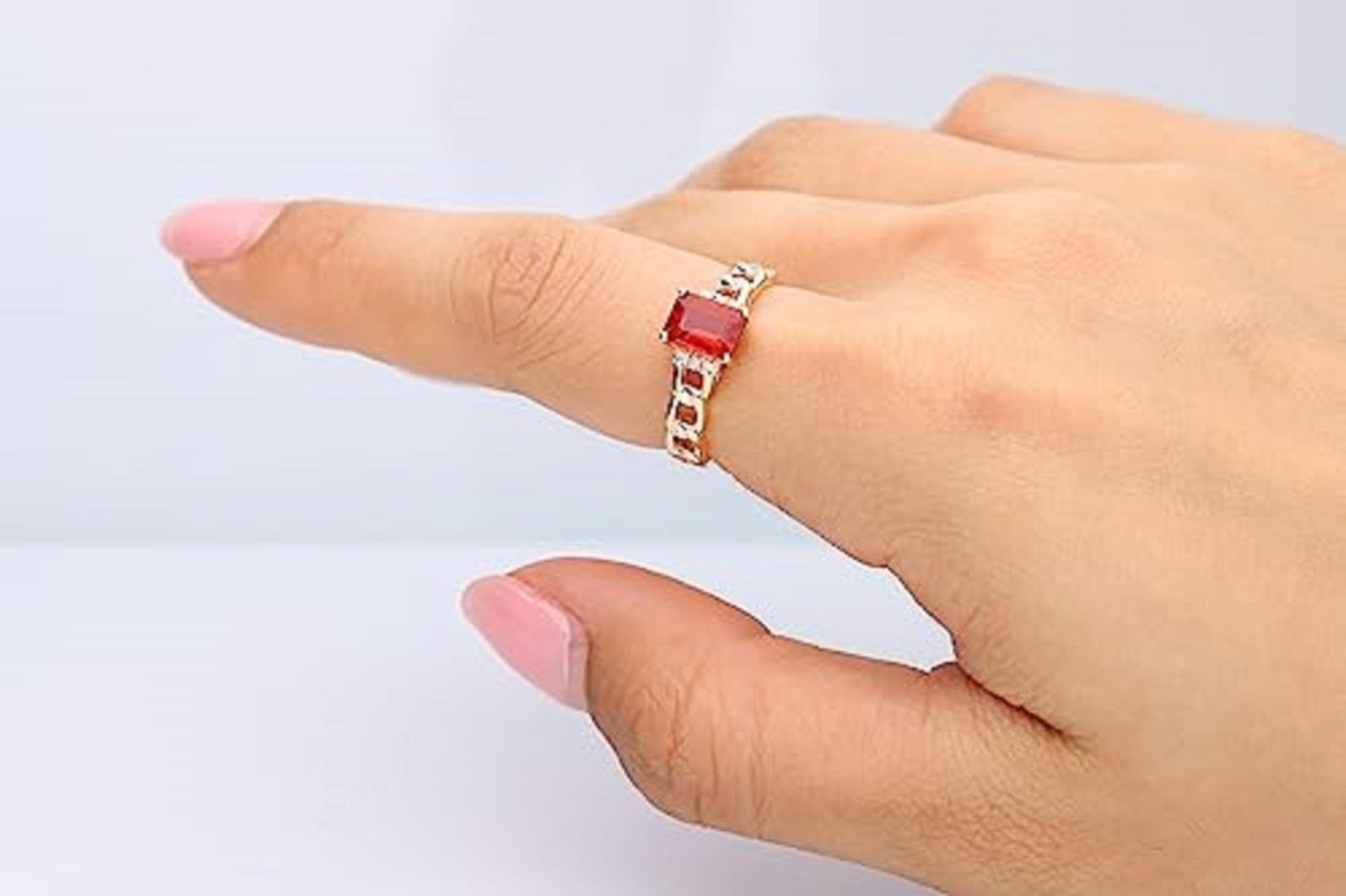Decorate yourself in elegance with this Ring is crafted from 14-karat Yellow Gold by Gin & Grace. This Ring is made up of 5*7 Emerald-cut Maxican Fire Opal (1 Pcs) 0.66 carat and Round-cut White Diamond (6 Pcs) 0.04 carat. This Ring is weight 2.50