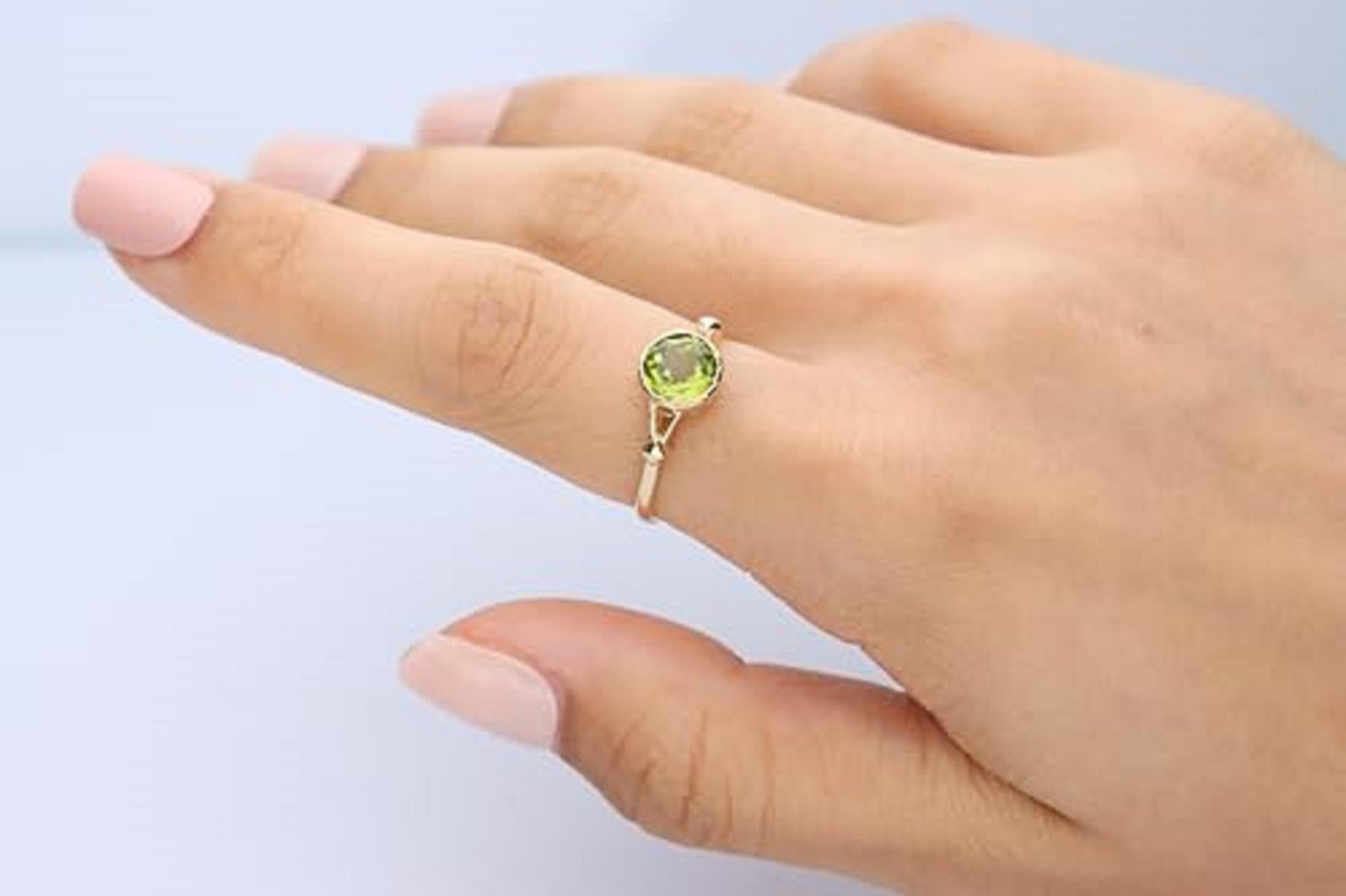 Decorate yourself in elegance with this Ring is crafted from 14-karat Yellow gold 7.0 mm Round-cut Peridot (1 pcs) 1.49 carat. This Ring is weight 1.92 grams. This delicate Ring is polished to a high finish shine.