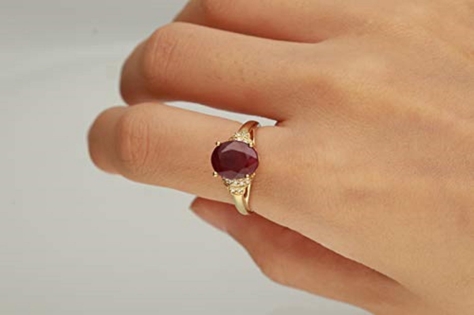 Decorate yourself in luxury with this Gin & Grace ring. The 14k Yellow Gold jewelry boasts 8X10 Oval-Cut Prong Setting Ruby stone (1pcs) 3.55 Carat, and Round-Cut Prong Setting (16pcs) 0.11 Carat white diamond accent stones for a glimmering design.