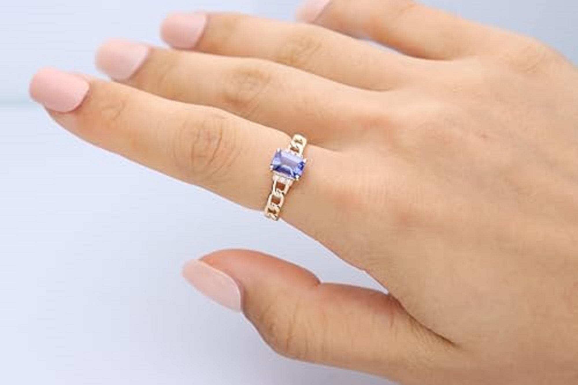 Decorate yourself in elegance with this Ring is crafted from 14-karat Yellow Gold by Gin & Grace. This Ring is made up of 5*7 Emerald-cut Tanzanite (1 Pcs) 0.91 carat and Round-cut White Diamond (6 Pcs) 0.04 carat. This Ring is weight 2.51 grams.
