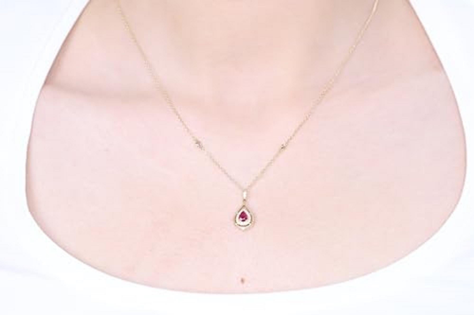 Decorate yourself in elegance with this Pendant is crafted from 14-karat Yellow Gold by Gin & Grace Pendant. This Pendant is made up of 4*5 Pear-cut Prong setting ruby (1 Pcs) 0.35 Carat and Round-Cut Prong setting White Diamond (20 Pcs) 0.16 Carat.