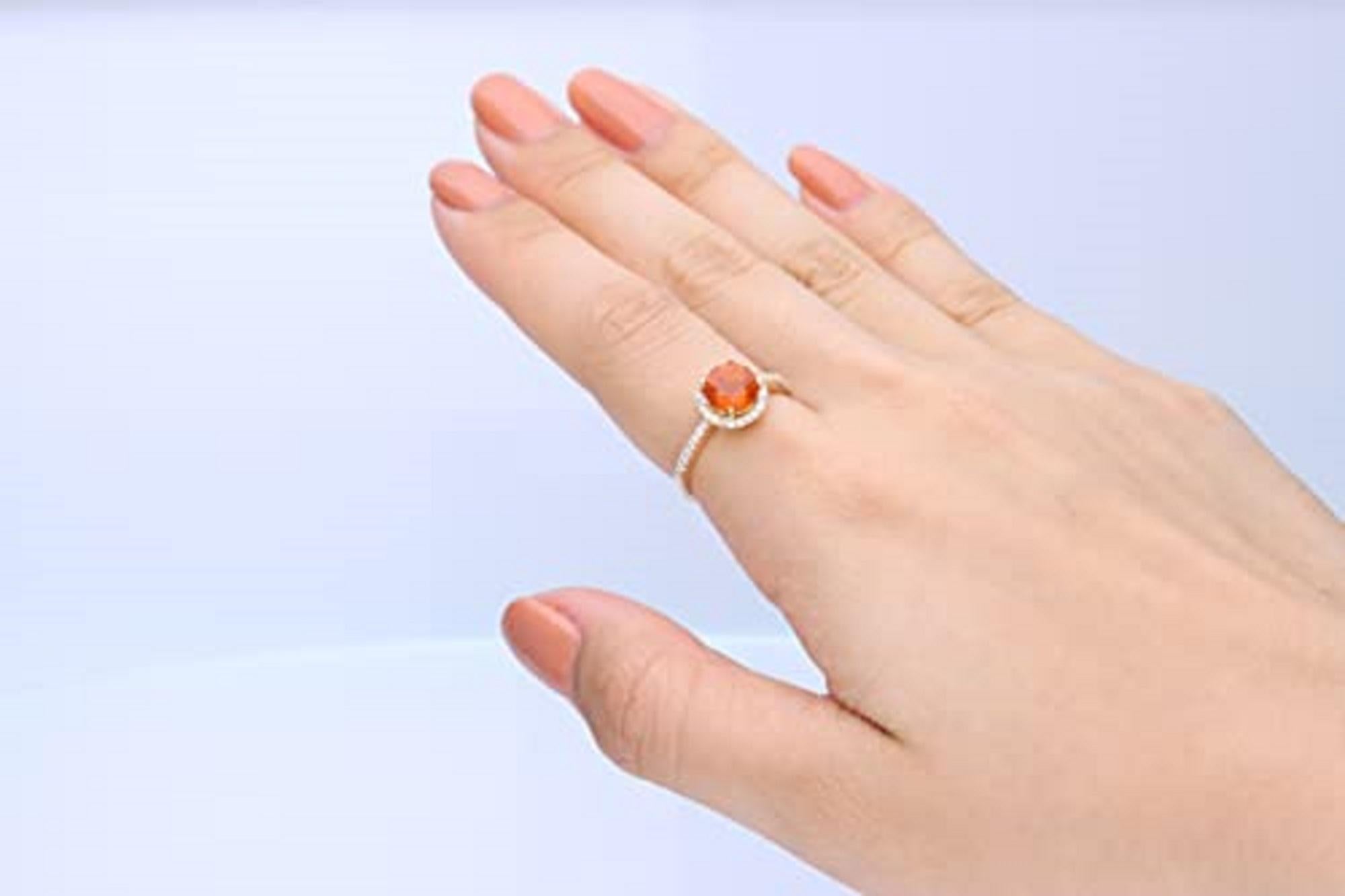 Decorate yourself in elegance with this Ring is crafted from 14-karat Yellow Gold by Gin & Grace. This Ring is made up of 7.0 fire opal round-cut (1 pcs) 0.97 and Round-cut Diamond (37 pcs) 0.20 Carat. This Ring is weight 2.61 grams. This delicate