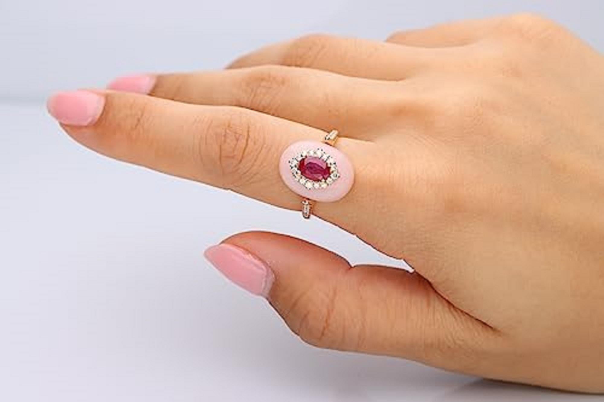 Decorate yourself in elegance with this Ring is crafted from 14-karat Yellow Gold by Gin & Grace. This Ring is made up of 5*7 oval-cut Ruby (1 pcs) 1 carat Ruby, pink opal free mix (1 Pcs) 7.18 Carat, Round Cut Diamond (30 Pcs) 0.28 Carat. This Ring