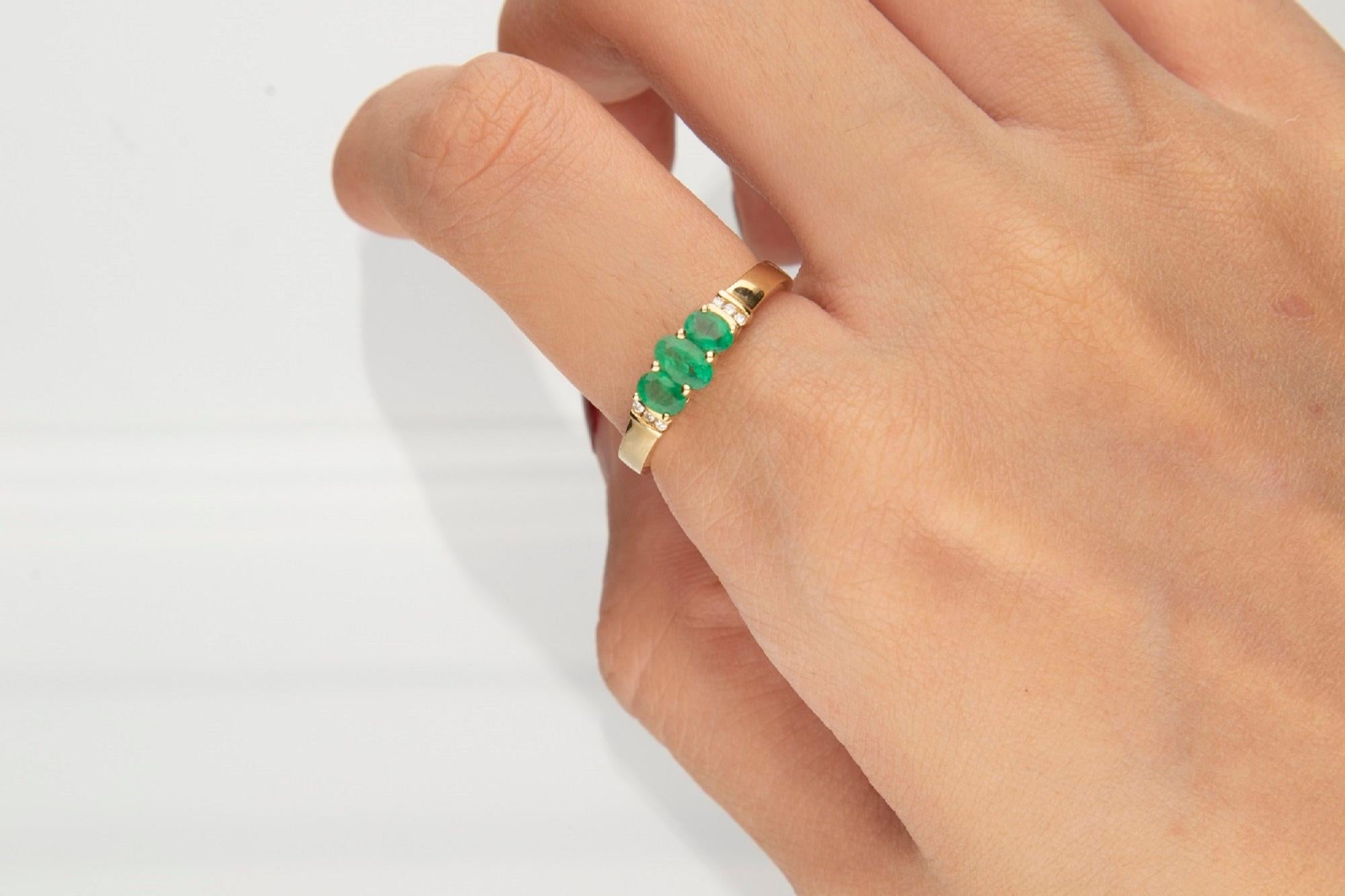 Stunning, timeless and classy eternity Unique Ring. Decorate yourself in luxury with this Gin & Grace Ring. The 14K Yellow Gold jewelry boasts Oval-Cut Prong Setting Natural Emerald (3 pcs) 0.53 Carat, along with Natural Round cut white Diamond (6