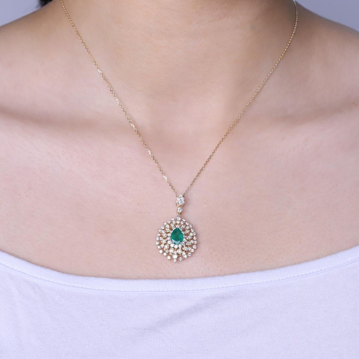 Decorate yourself in elegance with this Necklaces is crafted from 14-karat Yellow Gold by Gin & Grace. This Necklaces is made up of 6*8 Pear-cut Emerald (1 Pcs) 1.29 carat and Round-cut White Diamond (75 Pcs) 1.20 carat. This Necklaces is weight