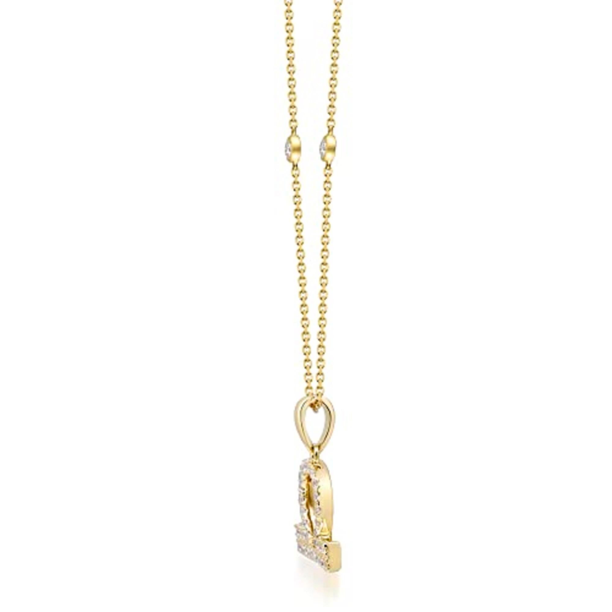 Faites preuve d'élégance avec ce pendentif en or jaune 14 carats de Gin and Grace. Ce pendentif est composé de diamants blancs taillés en rond (32 pièces) de 0,16 carat et de diamants blancs taillés en rond (2 pièces) de 0,06 carat. Ce pendentif