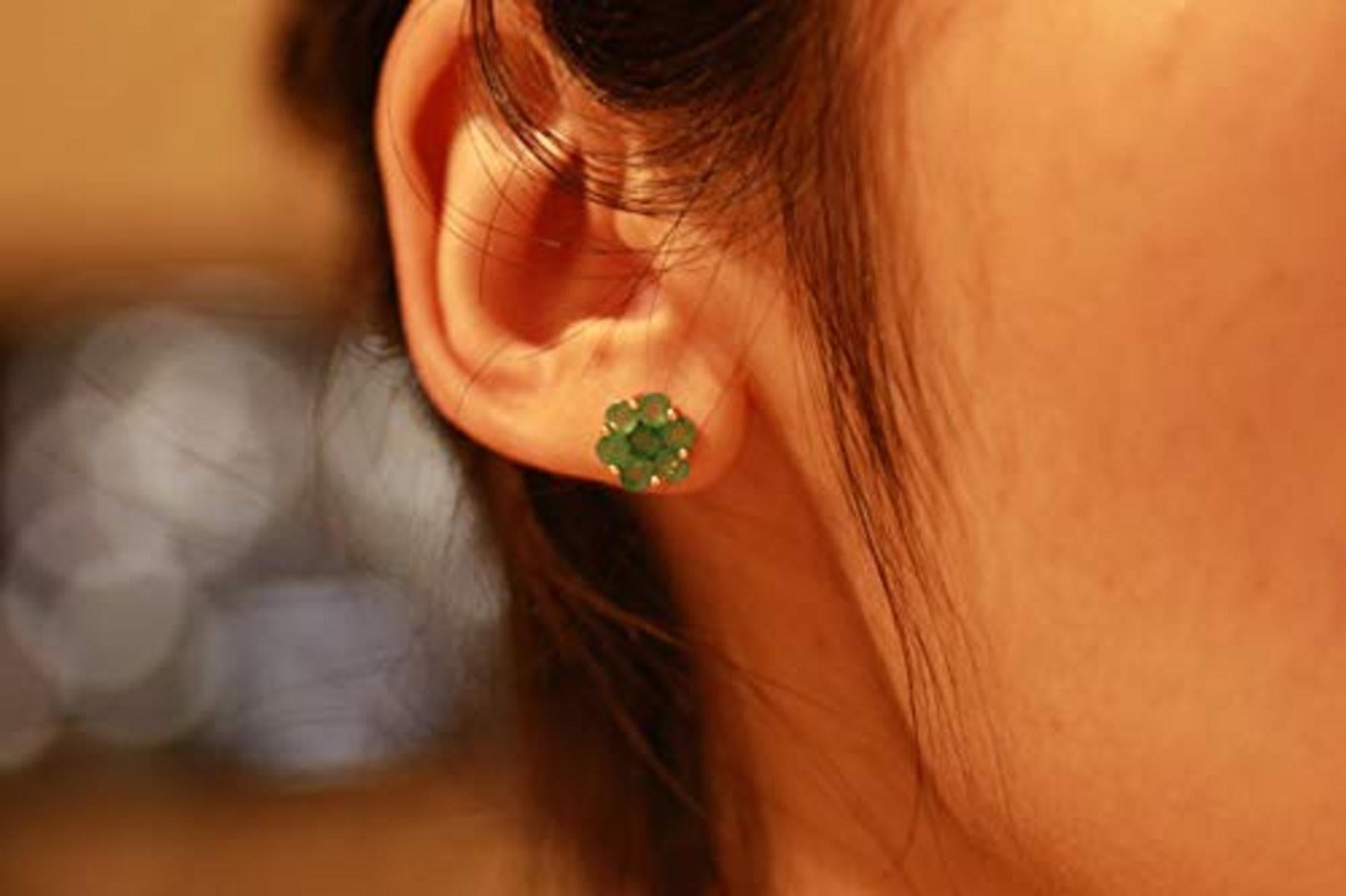 These earrings shine with clusters of round-cut prong-set Gin & Grace Natural emeralds. This jewelry piece features 14-karat yellow butterfly clasps. Style: Stud Gemstone colors: Green Gemstone shapes: Round Two prong-set round-cut Natural emerald