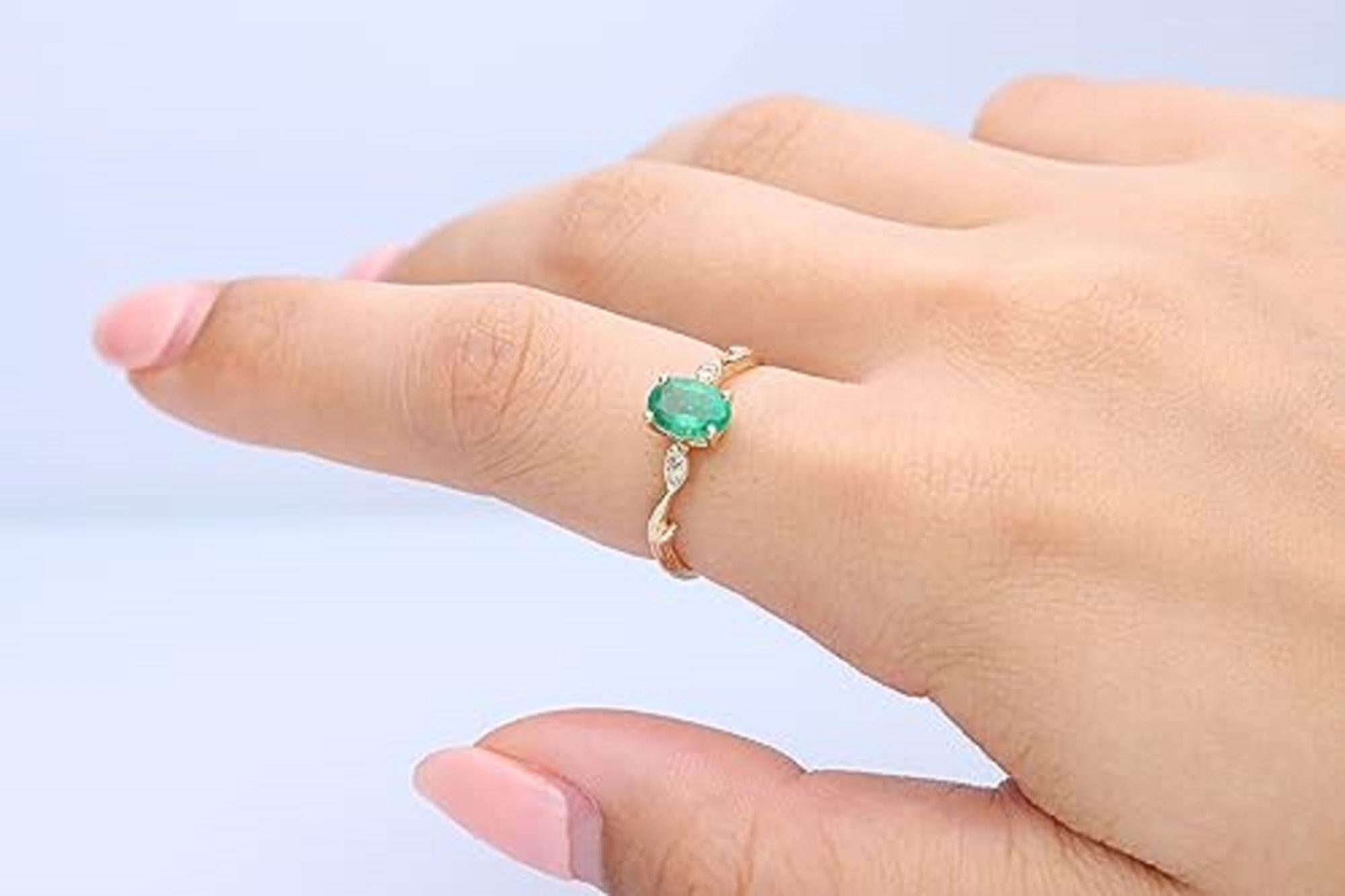 Decorate yourself in elegance with this Ring is crafted from 14-karat Yellow gold 5*7 Oval-Cut Emerald (1 pcs) 0.79 carat and Round-cut White Diamond (4 Pcs) 0.03 carat. This Ring is weight 1.78 grams. This delicate Ring is polished to a high finish
