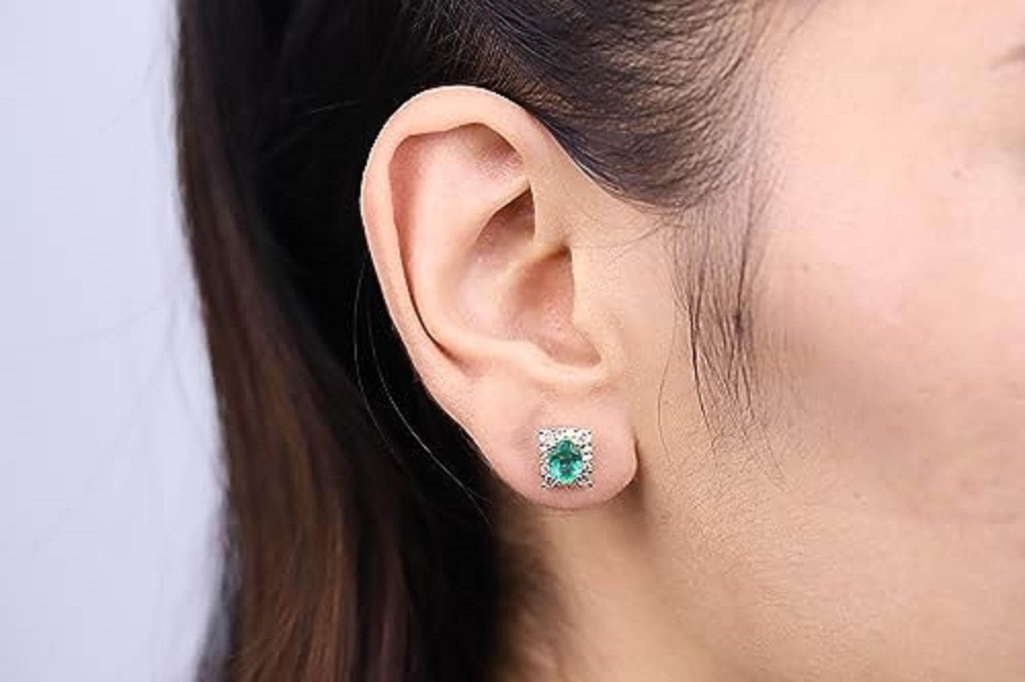 Decorate yourself in elegance with this Earring is crafted from 14-karat Yellow Gold by Gin & Grace. This Earring is made up of 7x5 mm Oval-cut Emerald (2 pcs) 1.33 carat and Round-cut White Diamond (28 Pcs) 0.72 Carat. This Earring is weight 2.50
