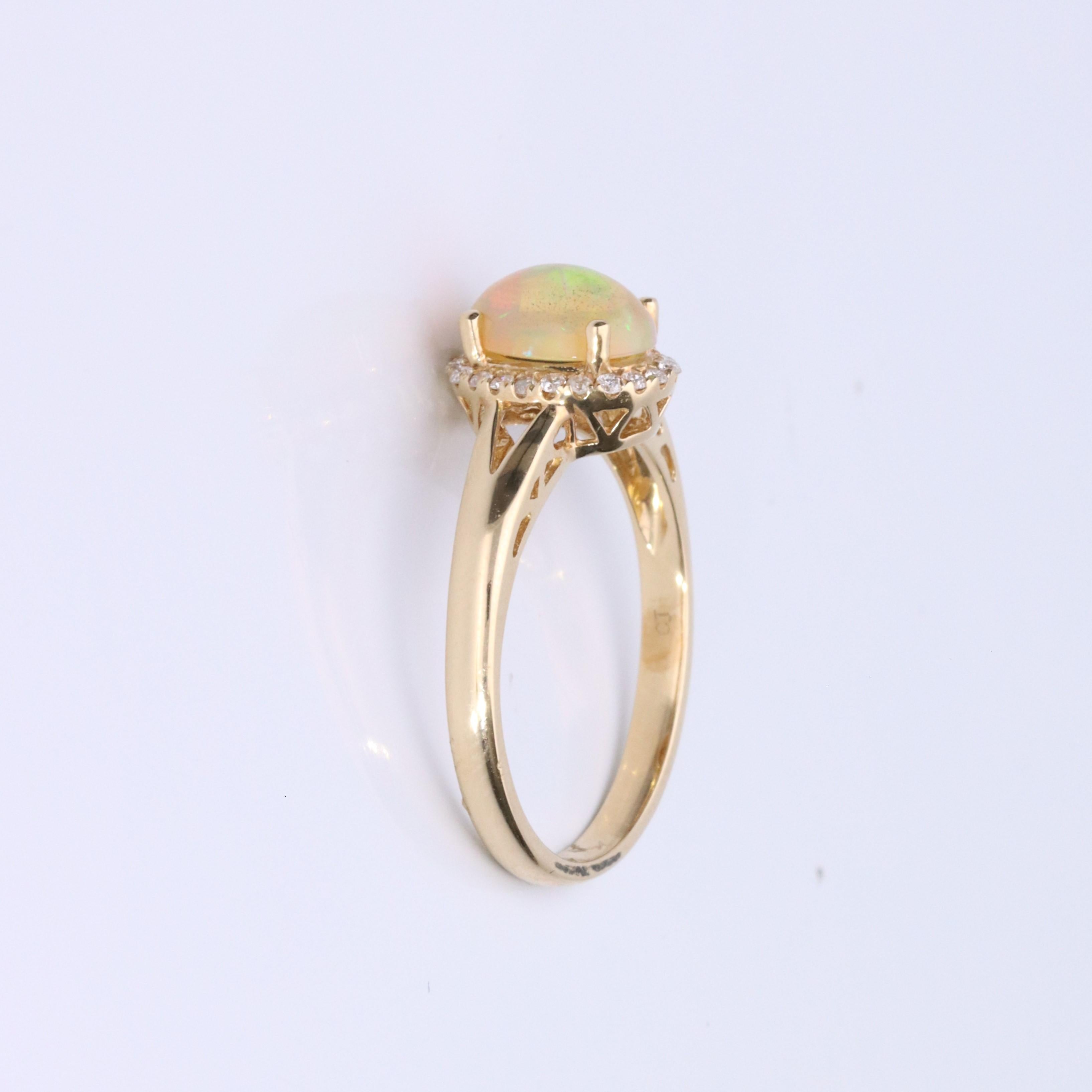 Decorate yourself in elegance with this Ring is crafted from 14-karat Yellow Gold by Gin & Grace. This Ring is made up of Oval-Cab (1 pcs) 0.89 carat Ethiopian Opal and Round-cut White Diamond (22 Pcs) 0.11 carat. This Ring is weight 2.34 grams.