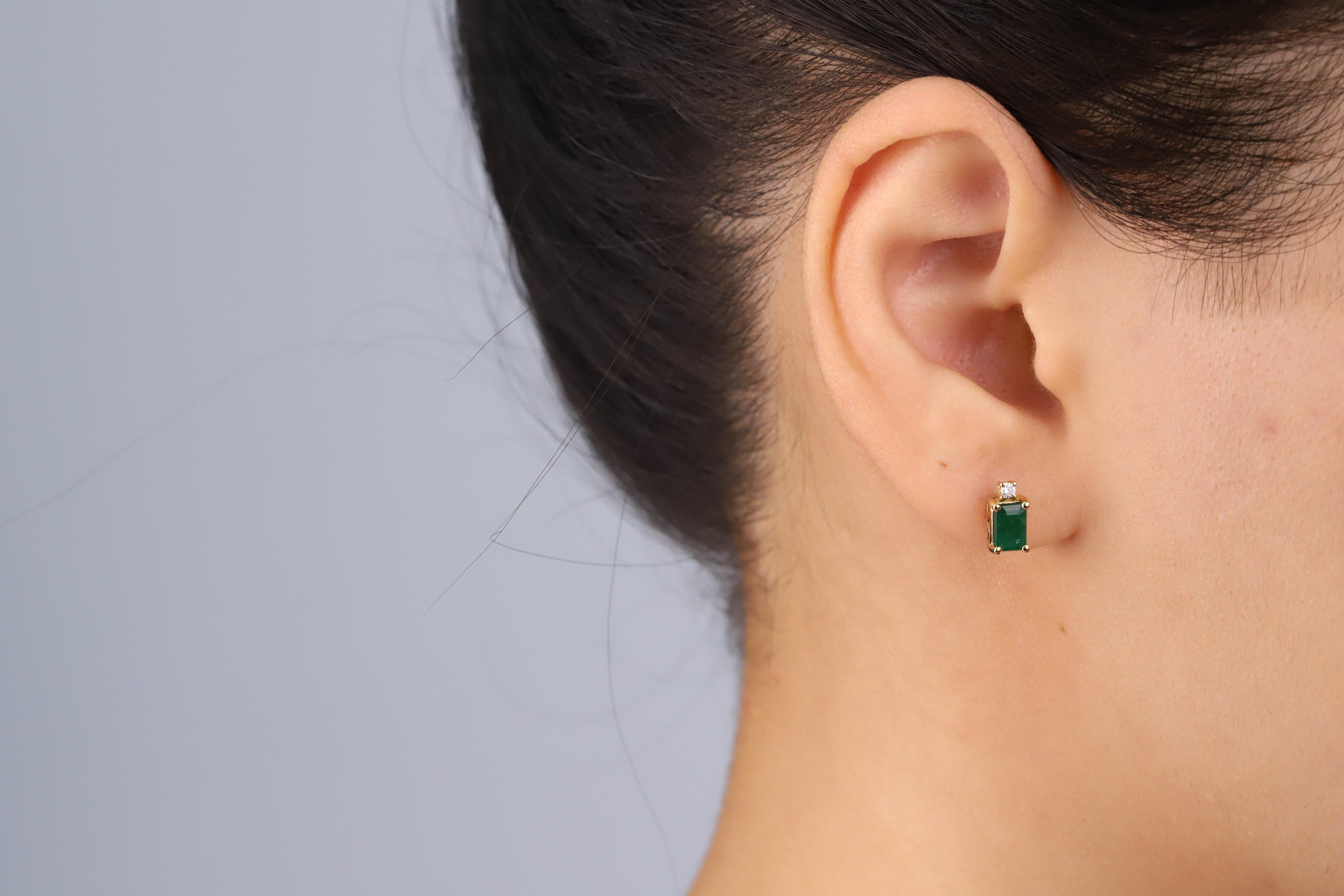 Decorate yourself in elegance with this Earring is crafted from 14K Yellow Gold by Gin & Grace Earring. This Earring is made up of 4X6 Emerald-Shape prong setting Emerald (2 pcs) 1.13 Carat and Round-Cut prong setting Diamond (2 pcs) 0.05 Carat.