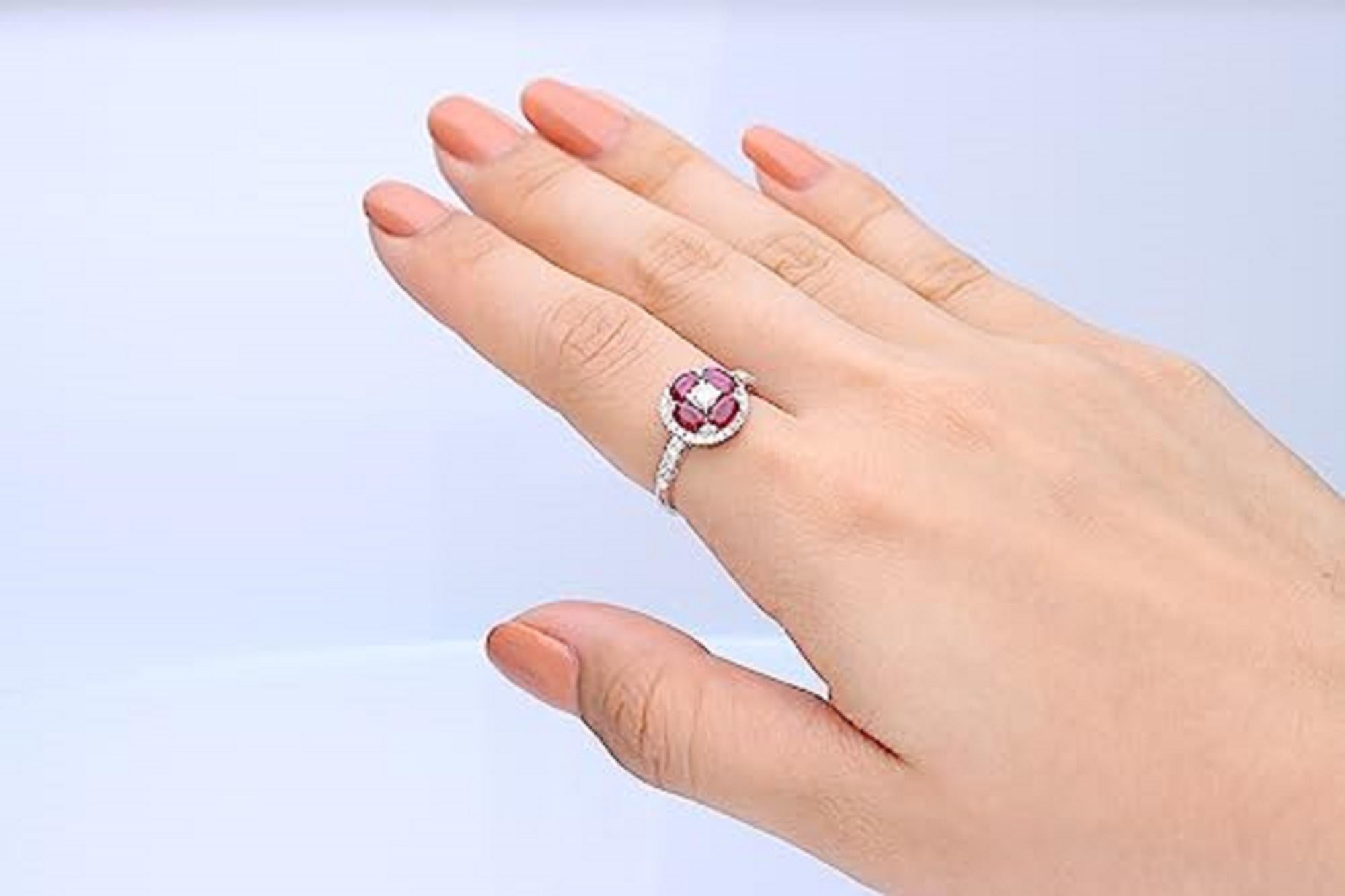 Decorate yourself in elegance with this Ring is crafted from 18-karat White Gold by Gin & Grace. This Ring is made up of 3*5 oval-cut Ruby (4 pcs) 0.90 carat Ruby and Round Cut Diamond (1 Pcs) 0.17 Carat, Round Cut Diamond (38 Pcs) 0.33 Carat . The