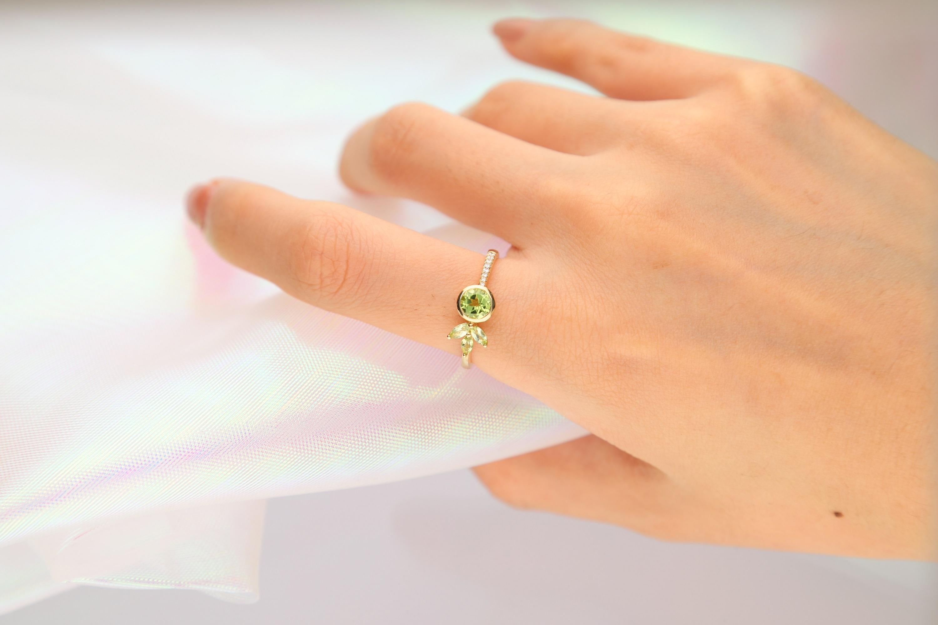 Stunning, timeless and classy eternity Unique Ring. Decorate yourself in luxury with this Gin & Grace Ring. The 14K Yellow Gold jewelry boasts with Round-Cut Peridot (1 pcs) 0.59 carat, Pear-cut Emerald (3pcs) 0.24 carat and Round Cut White Diamond