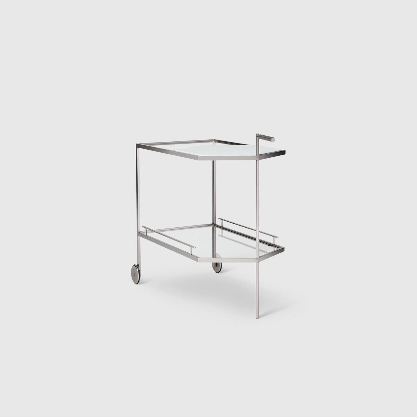 The Gin Lane bar cart by Yabu Pushelberg has a minimal profile in smoked bronze paired with Calacatta marble or smoked brass paired with Carrara marble. The simple profile takes precision craftsmanship by experts in Italy and creates a statement