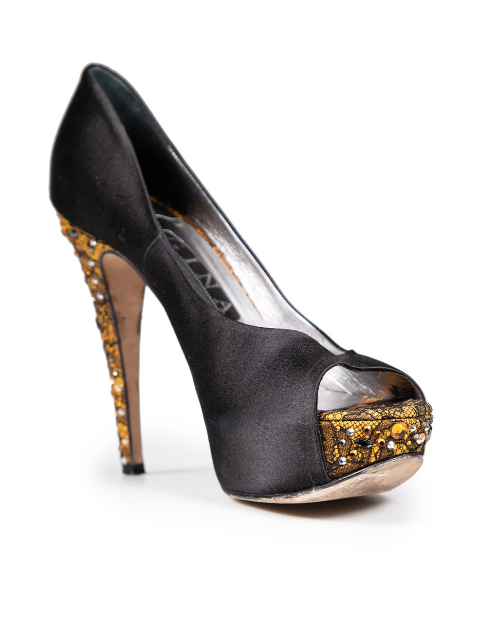 CONDITION is Very good. Minimal wear to the heels is evident. Deterioration to both heel tips. Plucks to the weave on the right counter and both sides of the bot shoes on this used Gina designer resale item. This pair of shoes comes in the original