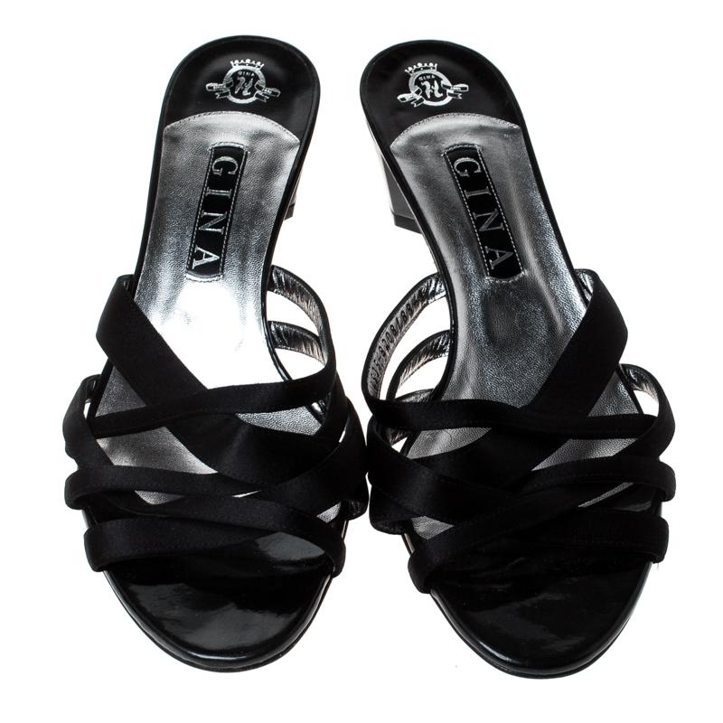 The house of Gina brings you these impressive sandals that complement any outfit. Keep it casual and chic with these satin sandals. Lined with leather, these sandals are made to offer you maximum comfort. Transform into the style diva that you are