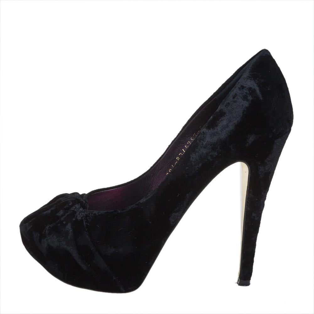 Elegance and grace all in one! These black Gina pumps have been crafted from plush velvet and styled with ruched detailing on the toes. They are equipped with comfortable leather-lined insoles and elevated on concealed platforms and 13 cm heels.