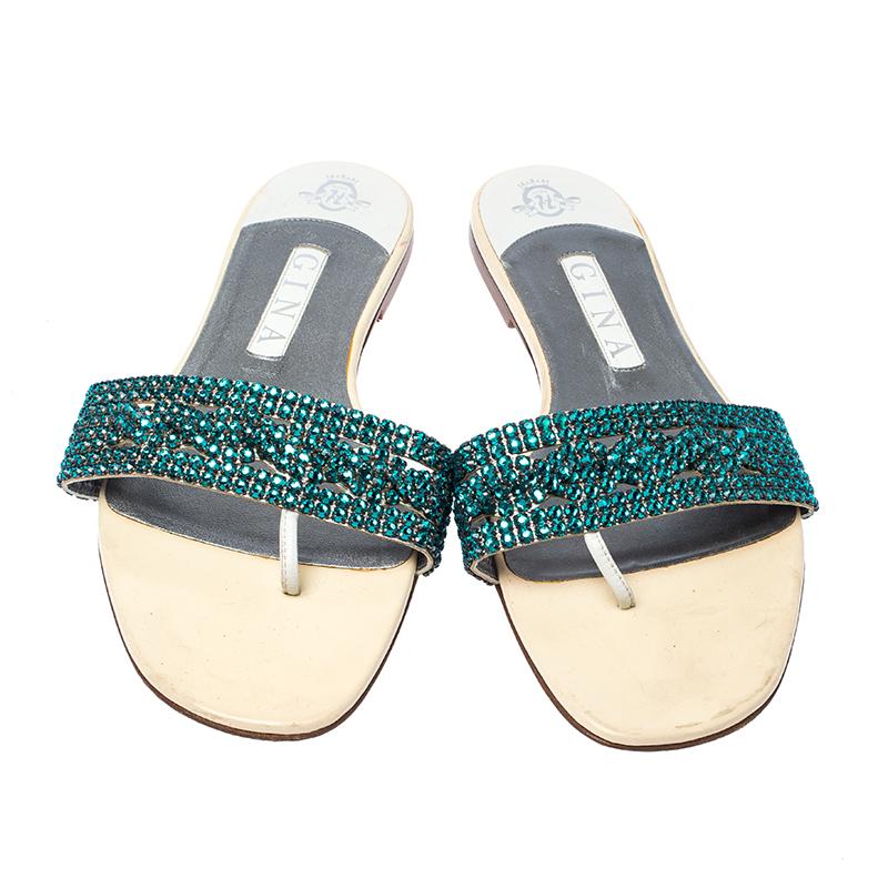 Wear these Gina sandals for a sparkling look. They feature a glamorous design with crystal embellished straps on the vamps coupled with leather lining. Comfortable to carry all day long, they will raise your style quotient manifolds.

Includes: The