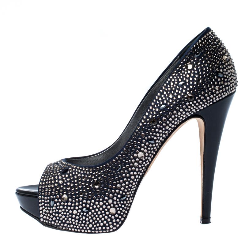 Dazzle the crowds and make the streets your fashion runway in these gorgeous pumps from Gina! These blue pumps are crafted from satin and feature a peep-toe silhouette. They flaunt crystals embellished all over the exterior, leather-lined insoles,