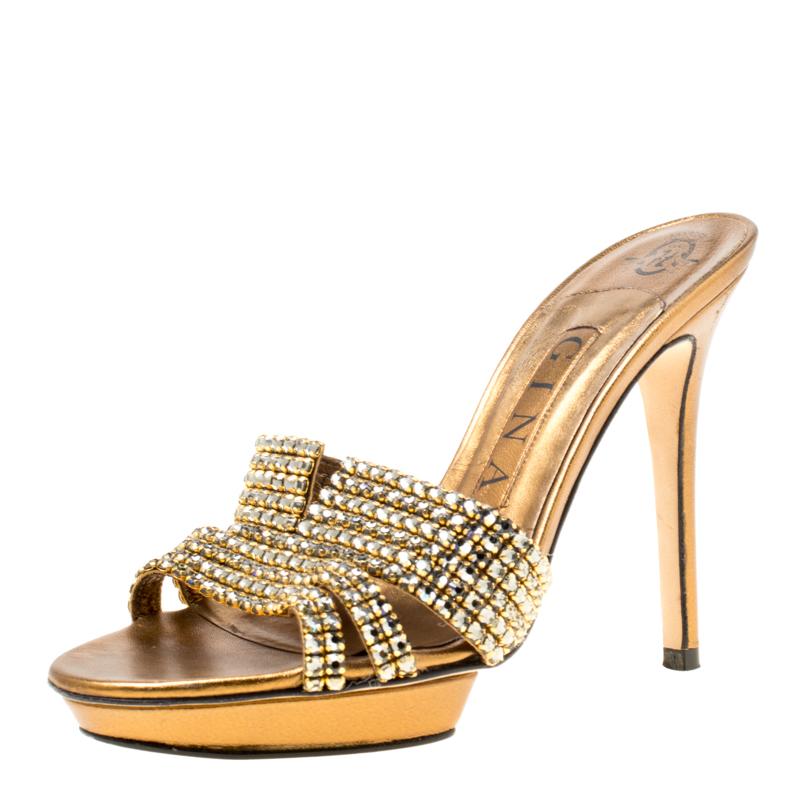 You'll be all set to shine with style in these dazzling Gina sandals. They are crafted from leather and designed with crystals, platforms and 11.5 cm heels. These sandals are sure to attract admirers!

Includes: The Luxury Closet Packaging


