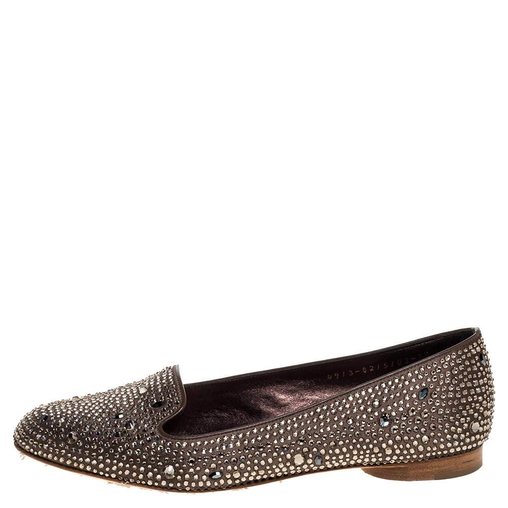 A glittering creation from Gina, these ballet flats can truly transform an outfit. They have been crafted from luxurious satin and completely embellished with crystals. They are lined with leather and have comfortable leather soles. A gorgeous brown