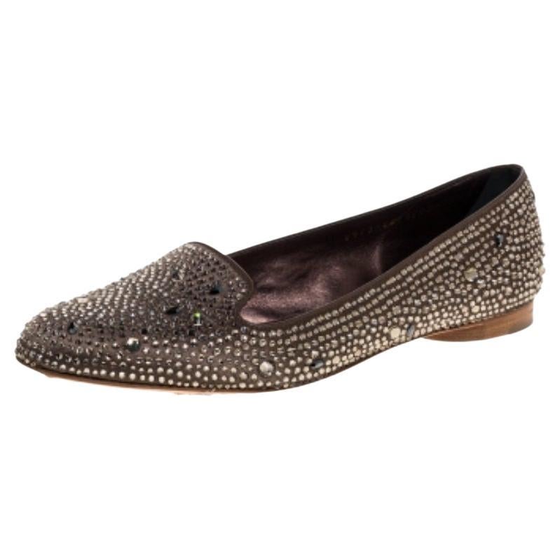 A glittering creation from Gina, these ballet flats can truly transform an outfit. They have been crafted from luxurious satin and completely embellished with crystals. They are lined with leather and have comfortable leather soles. A gorgeous brown