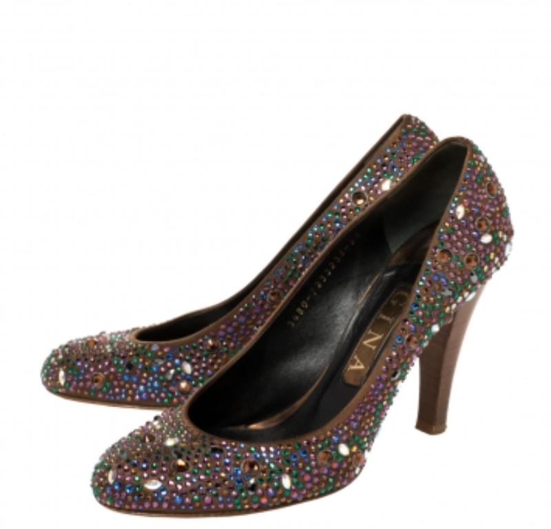 Exquisite crystal embellishments decorate the exterior of these Gina pumps. Created from brown satin into a round toe silhouette and elevated on 10 cm heels, these pumps offer comfort with their leather-lined insoles. They are perfect for your