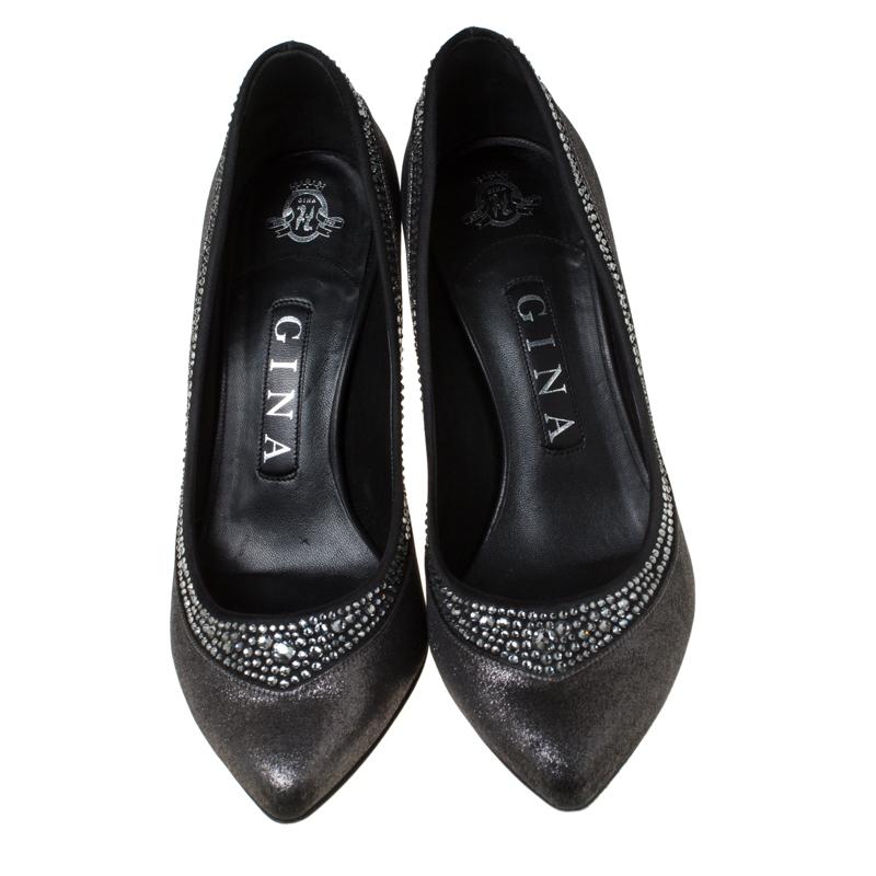  Add tons of glamour to your look by donning these pumps from Gina. Crafted from textured fabric, they feature pointed toes, stiletto heels and crystal embellishments. These chic pumps will make you shine.