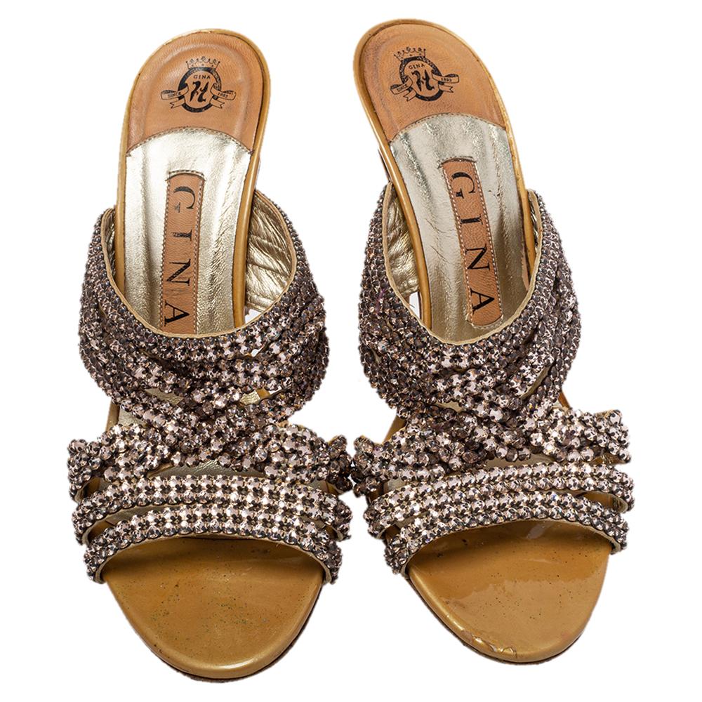 These lovely Gina slides will bring you the right amount of style and comfort. They feature leather straps embellished with crystals across the vamps and 9.5 cm heels. They are pretty and easy to flaunt.

Includes: Original Dustbag, Branded Box