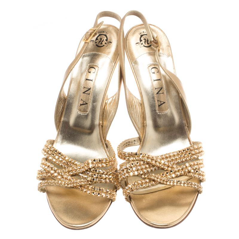 Add sparkle to your wardrobe with these gorgeous sandals from Gina! These metallic gold sandals are crafted from leather and feature exquisite crystal embellished vamp straps. They come equipped with leather insoles and are perfect for days when you