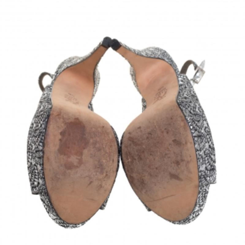 Those stylish outfits will look a lot more appealing with these gorgeous platform sandals from Gina. They have been crafted from metallic silver glitter into a peep-toe silhouette and styled with low-cut vamps and buckled slingbacks. They are made