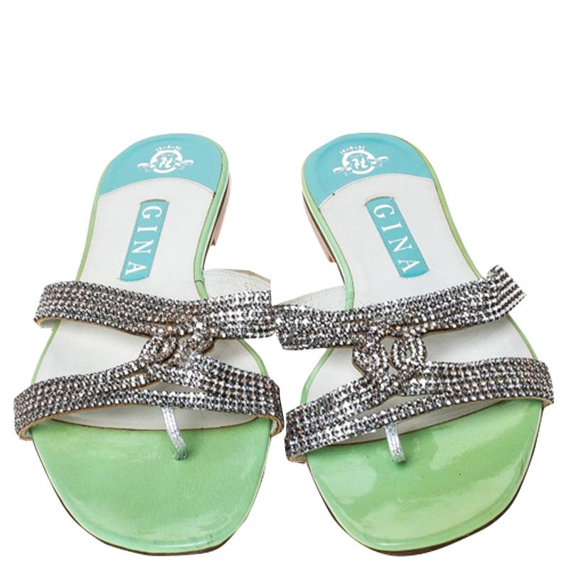 We can't stop gushing over these stunning flat slides from Gina. They flaunt such exquisite details, like the crystal embellishment, the open toes and the leather lining. You will truly love to own these beauties.

Includes: The Luxury Closet