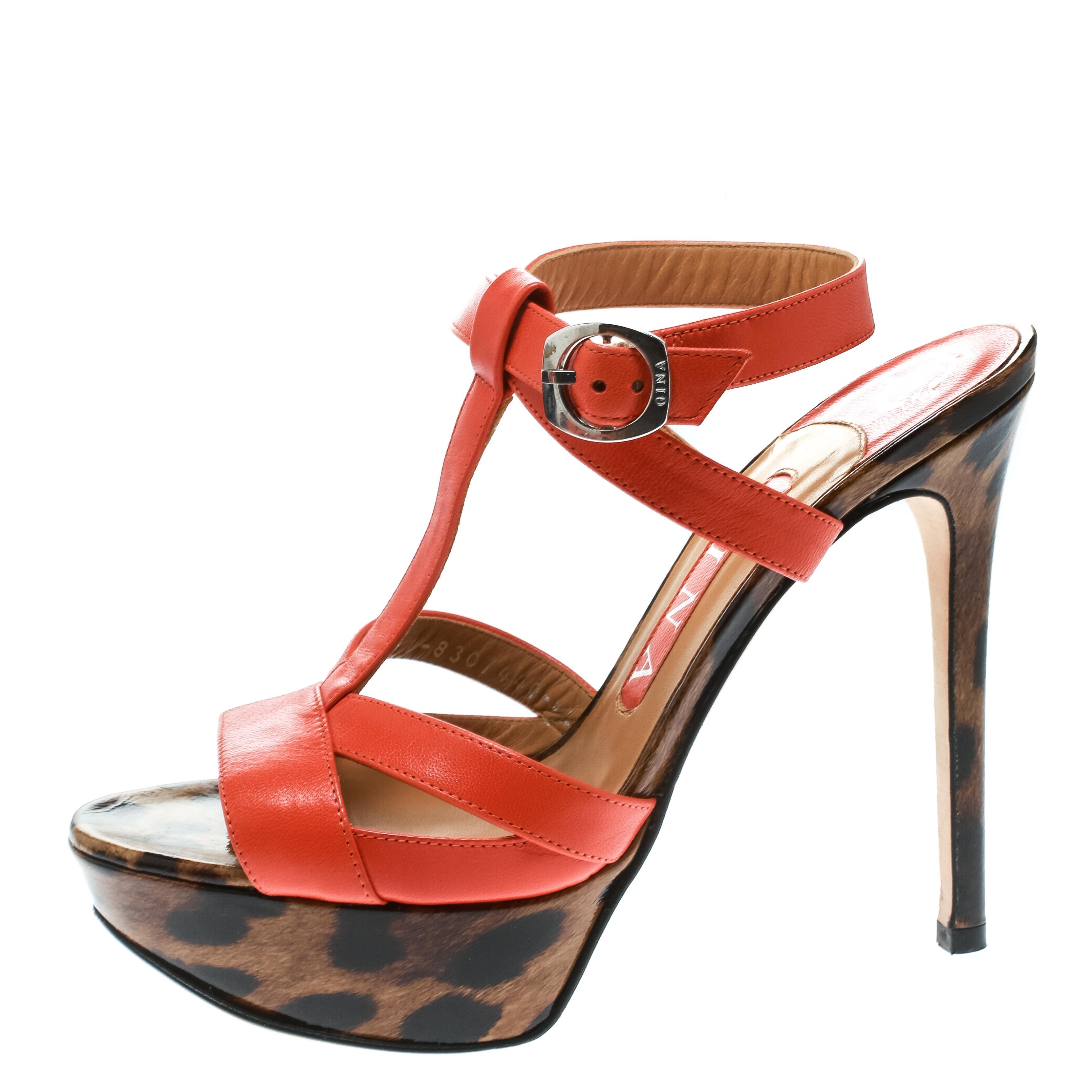 The right shoes do not only make a woman look fabulous but also gives her confidence. These Gina sandals bring elegance and wonder in their design of orange leather straps, ankle buckle fastenings and the leopard print on the platforms and
