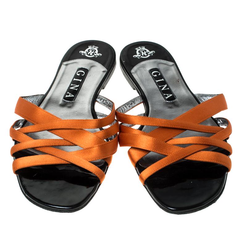 Give a pop of color to your everyday outfits with these Gina orange flat sandals. They're perfect for day outings or even to run errands. They feature straps in satin over the vamps and insoles lined with leather.

Includes: The Luxury Closet