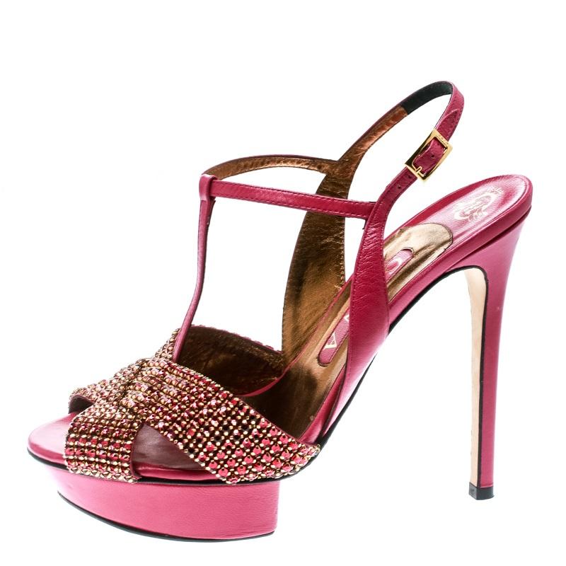 The beautifully embellished crisscross straps at the front and a covetable T-strap silhouette make these sandals from Gina a contemporary pair, high on style and bling. They are rendered in pretty pink leather and are designed with buckle closures,